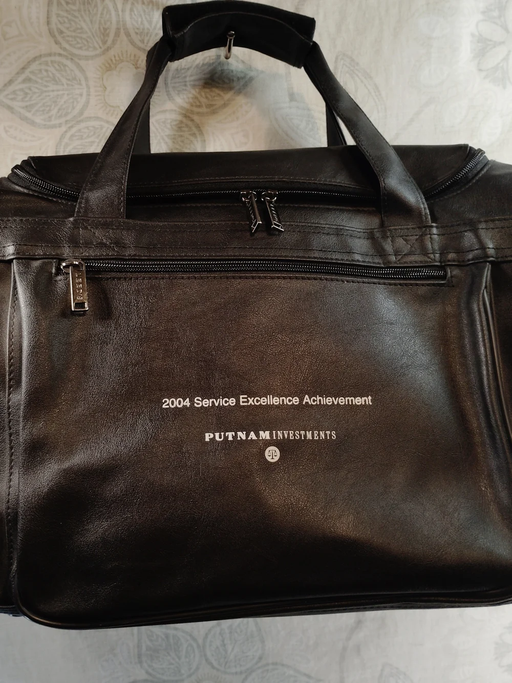Leeds Black Faux Leather Duffel/Travel Bag w/Front & Side Zipper Pockets w/ Logo